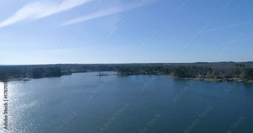 Aerial drone footage over a lake in the mountains