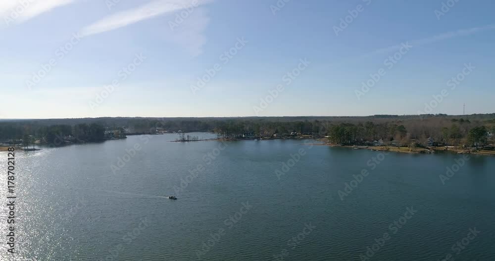 Aerial drone footage over a lake in the mountains