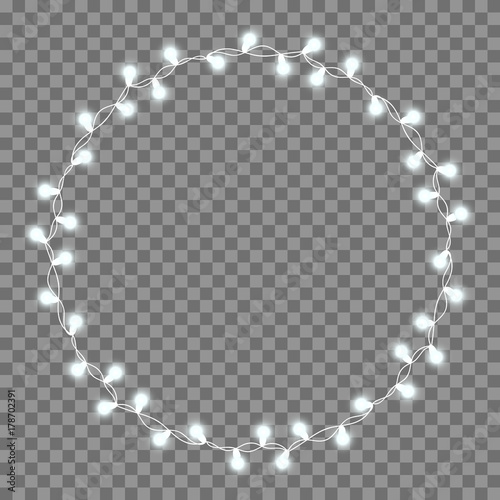 Christmas tree string garland in circle shape and text space isolated on dark background. Realistic Christmas, New Year party decorations with transparency. Light bulb decor. Lights border