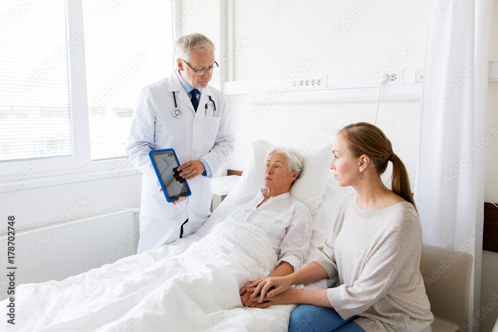 senior woman and doctor with tablet pc at hospital senior woman and doctor with tablet pc at hospital
