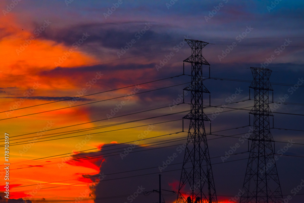 Naklejka premium Electricity station. Close up high voltage power lines at sunset.