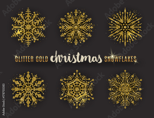 Set of glitter gold ornate snowflakes. Vector illustration.