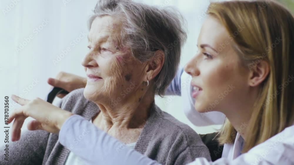 Health visitor and a senior woman during home visit. Health visitor and a senior woman during home visit.