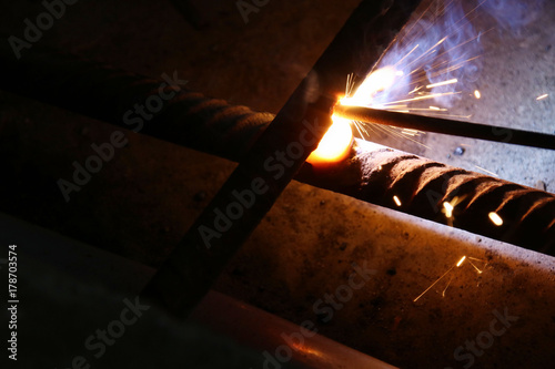 Welding of the reinforcing steel rods for reinforced concrete photo