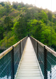 On a suspended bridge in a quiet mountain