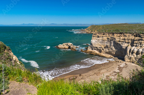 Exploring the Pacific shoreline at Spooner's Cove, Bluff Trail, Montana de Oro State Park, Morro Bay, San Luis Obispo County, California, USA