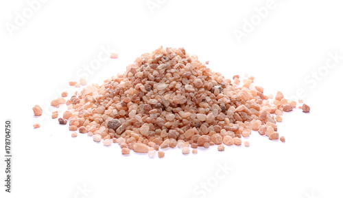 Himalayan salt grains isolated on white background