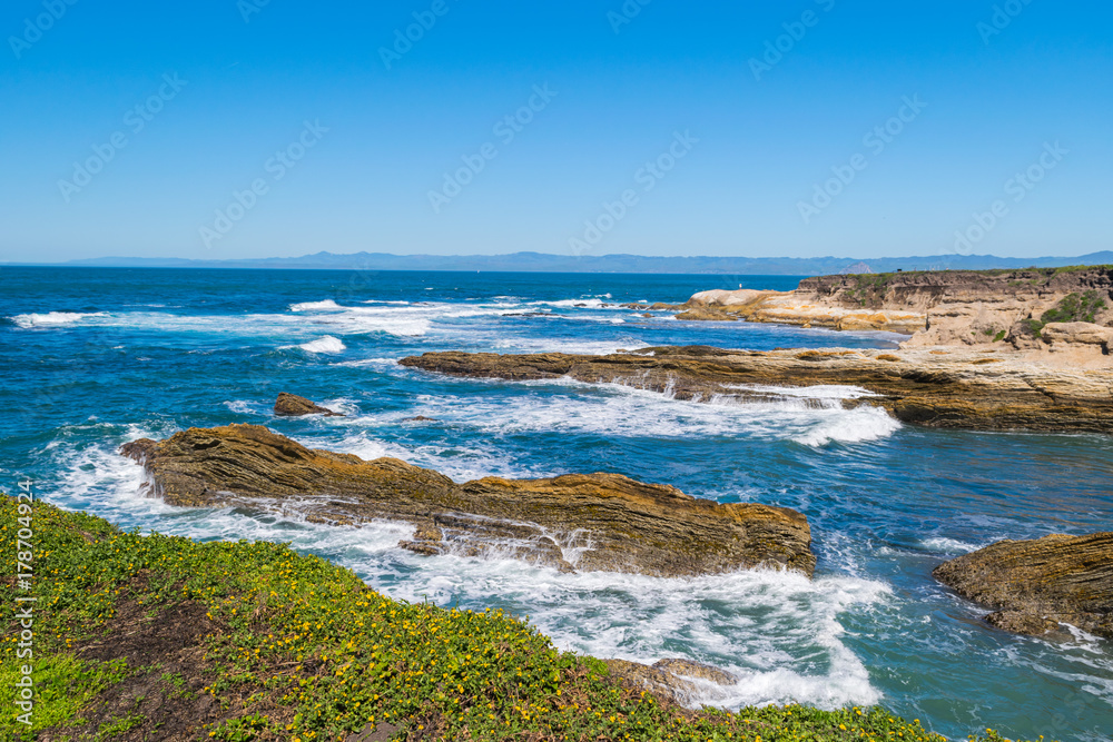 Exploring the Pacific shoreline at Spooner's Cove, Bluff Trail, Montana de Oro State Park, Morro Bay, San Luis Obispo County, California, USA