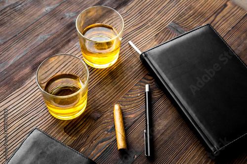 Relax for men. Whiskey in the evening. Glasses, wallet, cigar on rustic wooden background