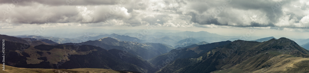 Beautiful view on Rodna mountains with dramatic sunshine through clouds at Romania country Beautiful view on Rodna mountains with dramatic sunshine through clouds at Romania country