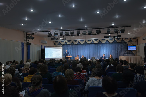 Speaker giving a talk in conference hall at educationevent. © Lyubov Furs