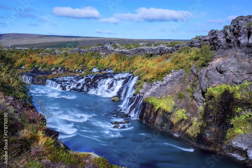 Many waterfalls, a beautiful fast river. sunlight beautiful day. Iceland. Cascade of waterfalls in the gorge. 