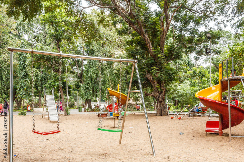Isolated swinger in an outdoor environment for kids to play. Isolated swinger in an outdoor environment for kids to play.