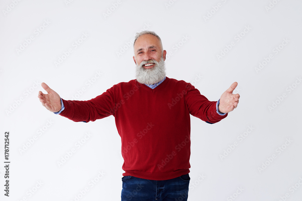Positive bearded mature man posing with open hands Positive bearded mature man posing with open hands