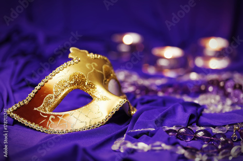 Colorful Mardi Gras or Carnival masks group on a purple background