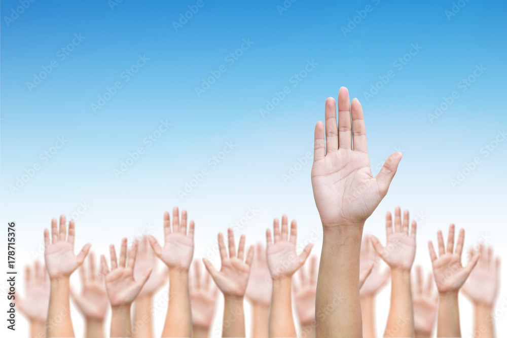 Business crowd raising hands high up on blue skies background. Concept Business / Question / Ask / Idea. Business crowd raising hands high up on blue skies background. Concept Business / Question / Ask / Idea.