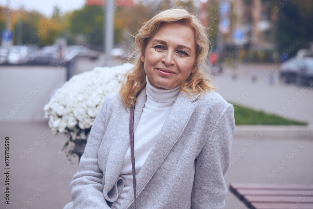Delighted mature woman posing on the street Delighted mature woman posing on the street