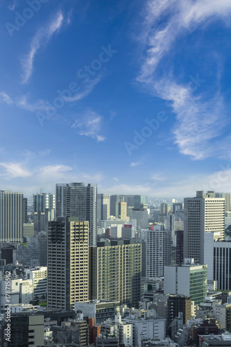Aerial skyscraper view of office building and downtown and cityscapes of Tokyo city with blue sly and clouds background. Japan  Asia