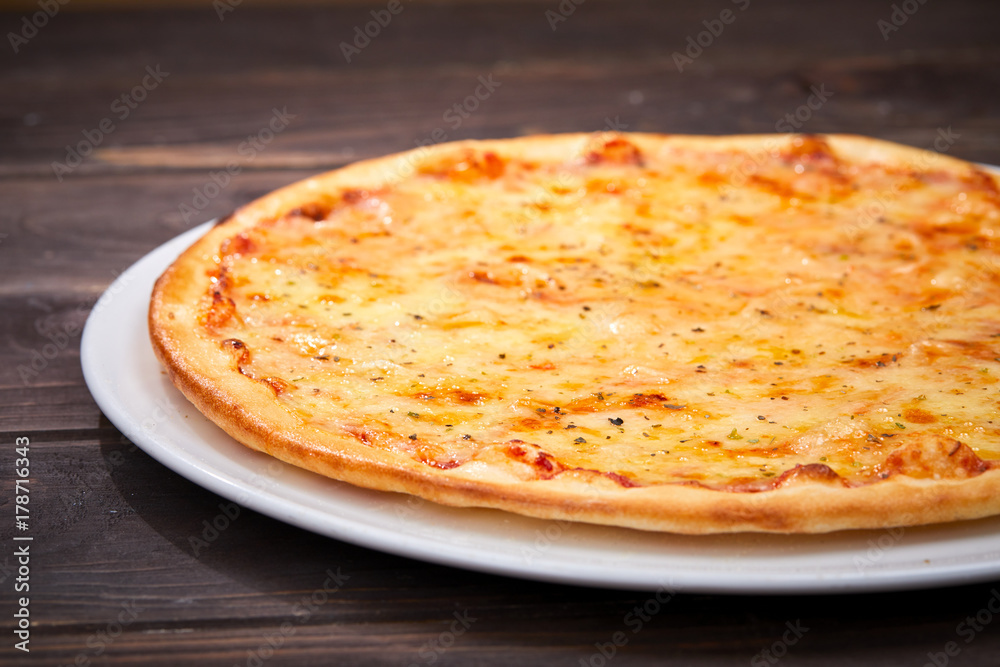 pizza on the wooden background