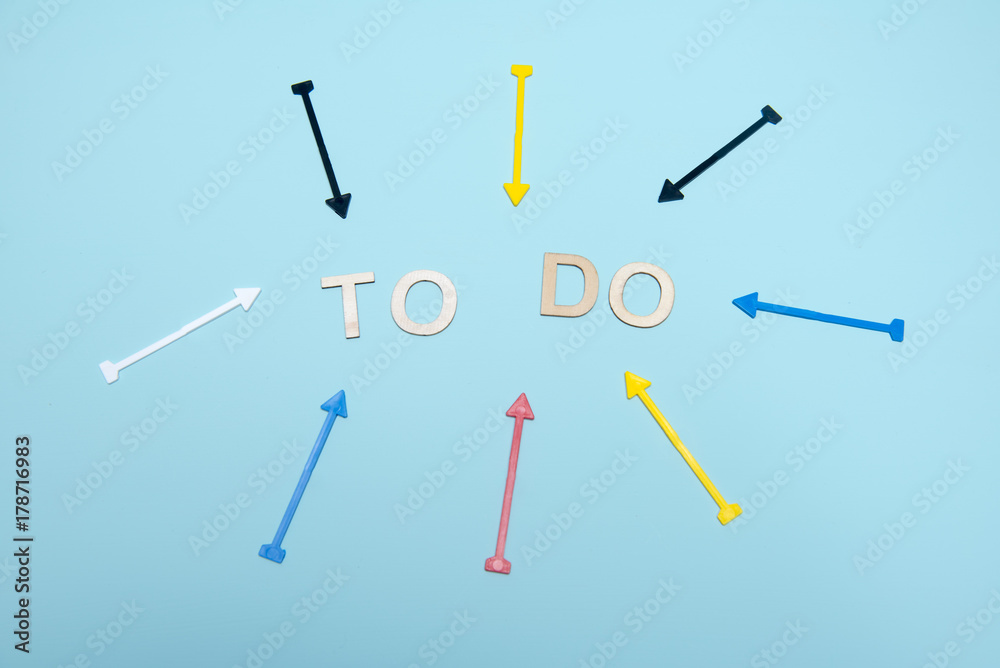 Blue background image with colourful arrows pointing at the words to do Blue background image with colourful arrows pointing at the words to do