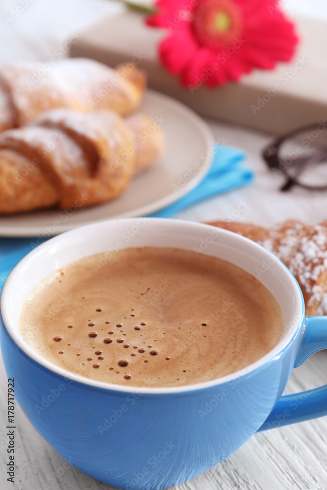 Cup of aromatic morning coffee on wooden table Cup of aromatic morning coffee on wooden table