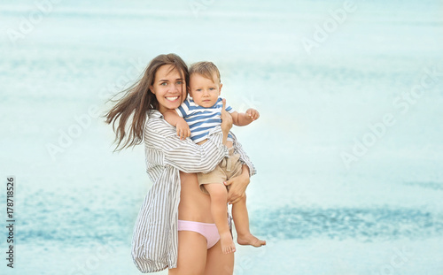 Happy mother with little so...