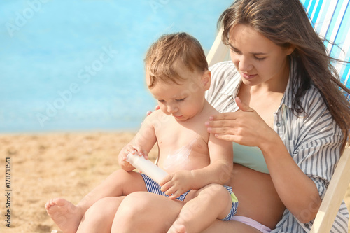 Happy mother with little so...