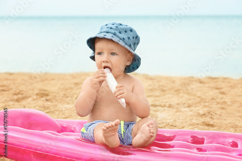 Cute baby boy sitting on in...