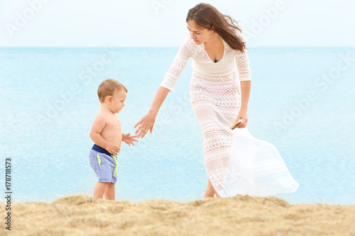 Happy mother with little so...