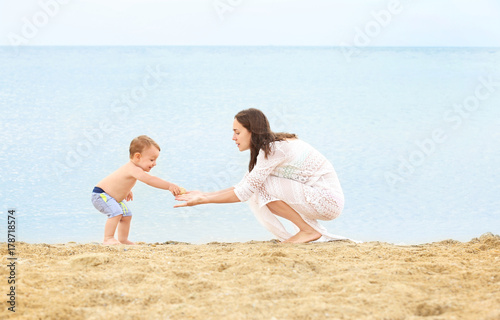Happy mother with little so...