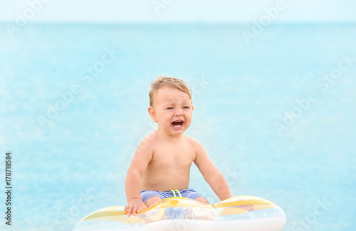 Cute little boy with inflat...