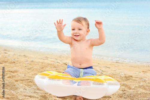 Cute little boy with inflat...