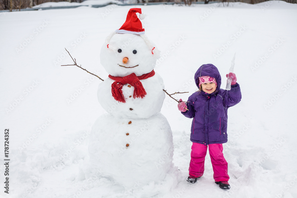little girl with snowman little girl with snowman