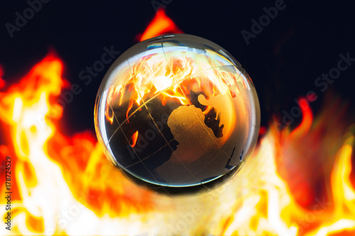 Transparent global on fire inside, Global warming conservative concept
