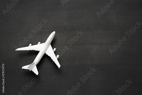 Miniature airplane on black background
