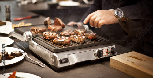 juicy steak on the grill. bbq. cooking steak. aromatic steak. grilled meat. delicious. hot steak.