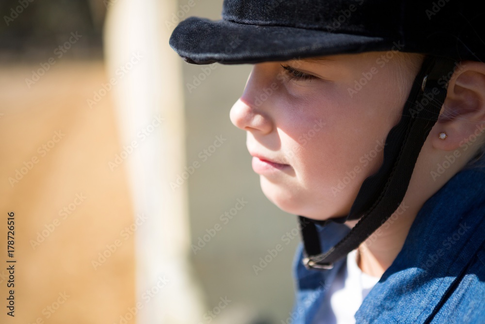 Girl sitting in the ranch on a sunny day Girl sitting in the ranch on a sunny day