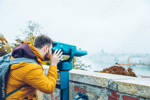 Photography man at observation deck enjoy view of the city