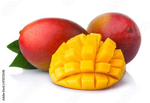 Ripe mango fruits with slices isolated on white background