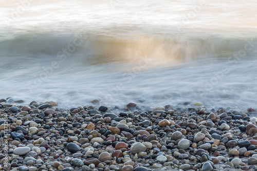 Waves rushing over stones on a Lake Huron beach - Ontario, Canada