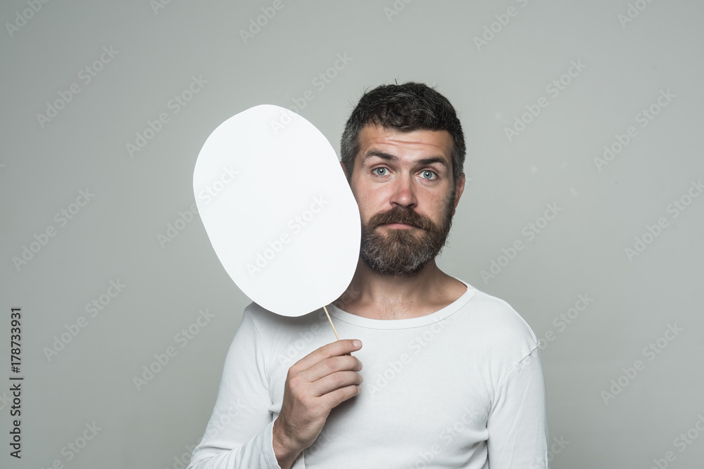 Hipster with sad face hold paper nameplate.