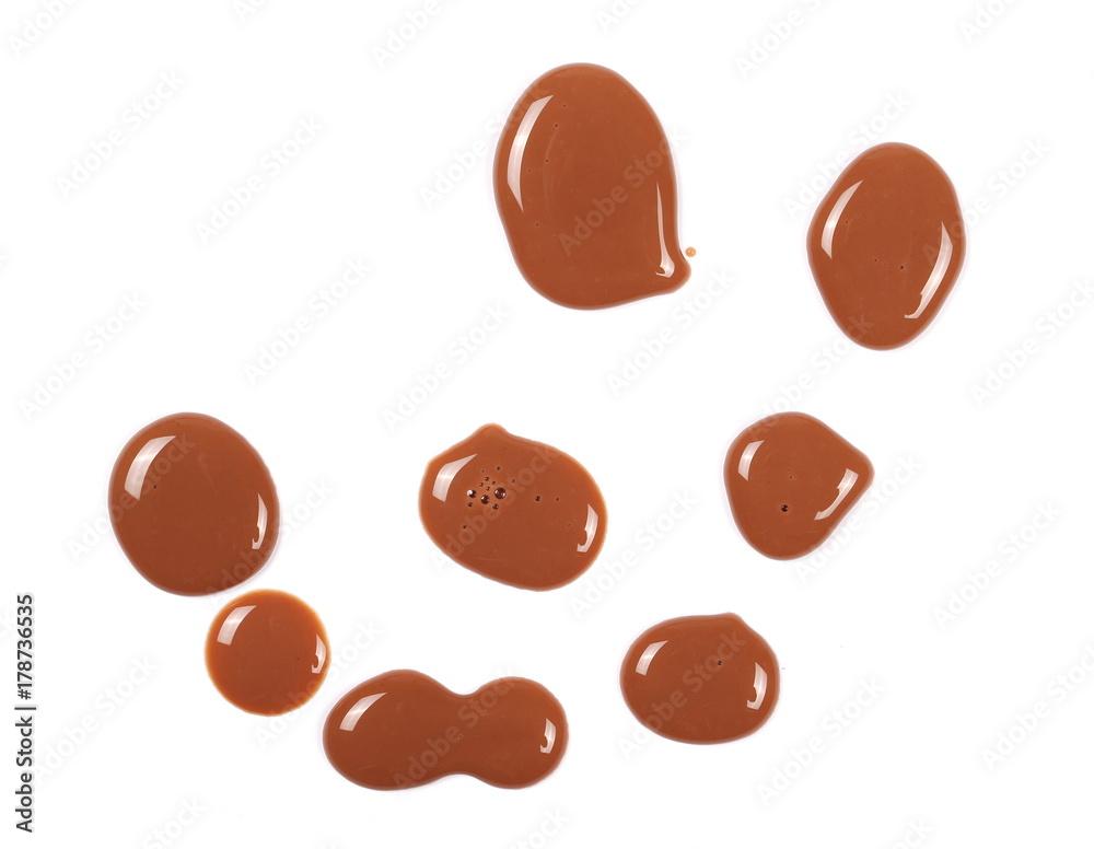 Fototapeta premium Spilled chocolate milk puddle isolated on white background, top view