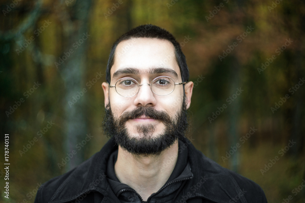 Ταπετσαρία Young Man Smiling at Camera, Enjoying Nature, Close Up Portrait, with forest gre
