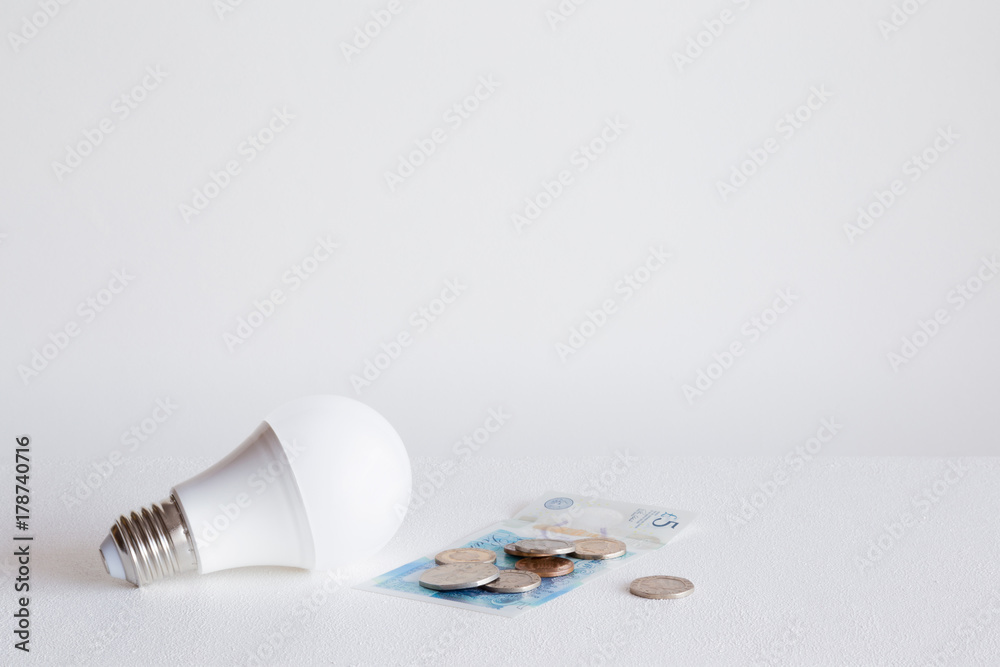 Led light bulbs with english pound on the gray background. Electricity payment concept. Empty place for a text and other ideas. Led light bulbs with english pound on the gray background. Electricity payment concept. Empty place for a text and other ideas.