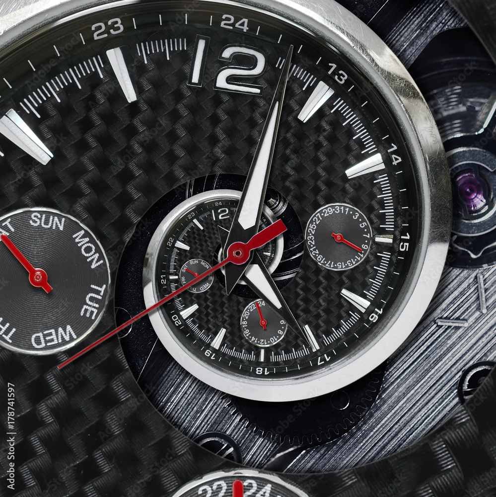 Modern silver black fashion clock watch red clock hands twisted to surreal time spiral. Surrealism clock black clock watch abstract fractal background Stylish clock texture pattern Concept time spiral Modern silver black fashion clock watch red clock hands twisted to surreal time spiral. Surrealism clock black clock watch abstract fractal background Stylish clock texture pattern Concept time spiral