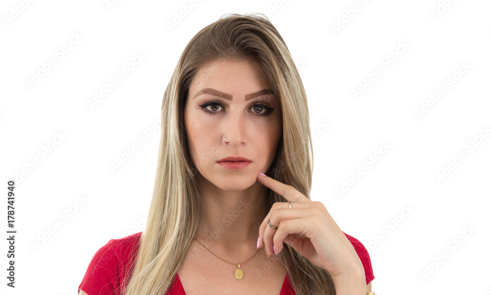 Beautiful woman with fingertip on chin. Blonde person and wearing red clothes. Isolated. Beautiful woman with fingertip on chin. Blonde person and wearing red clothes. Isolated.