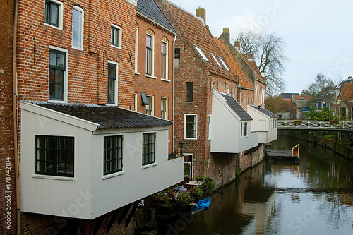 The Hanging Kitchens in the Dutch village Appingedam, built over a canal to spare room in houses photo