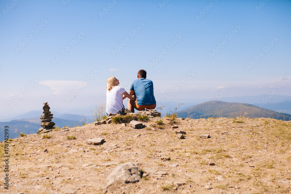 Young couple are admiring the landscape