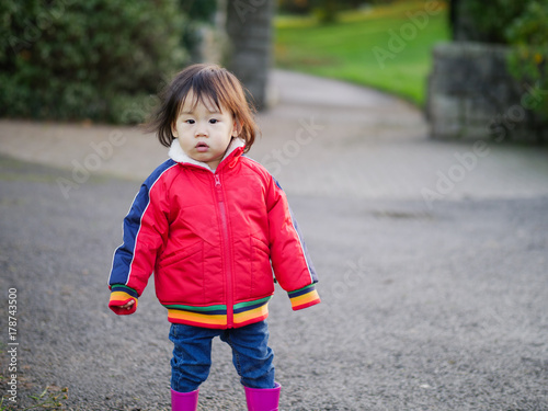 Baby girl playing at Autumn outdoor park © M-image