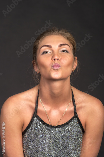 Portrait of a girl on a dark background.